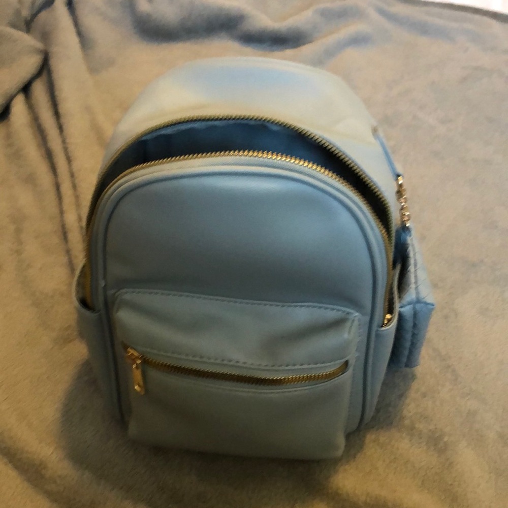 Blue backpack a couple of acids